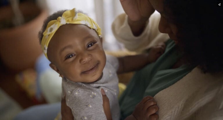 Children's Healthcare Of Atlanta highlights a baby smiling with mother in Atlanta